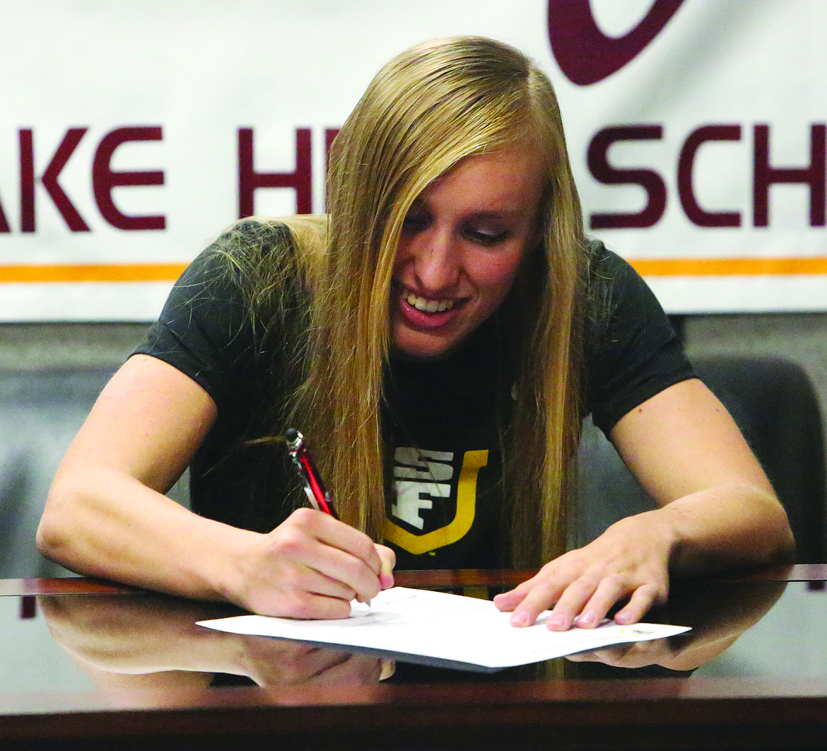 Connor Vanderweyst/Columbia Basin Herald
Moses Lake basketball player Abby Rathbun signs her national letter of intent to the University of San Francisco.