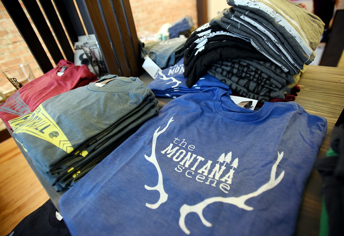 T-shirts on display at the new downtown location of The Montana Scene on Thursday, November 2, in Kalispell.(Brenda Ahearn/Daily Inter Lake)