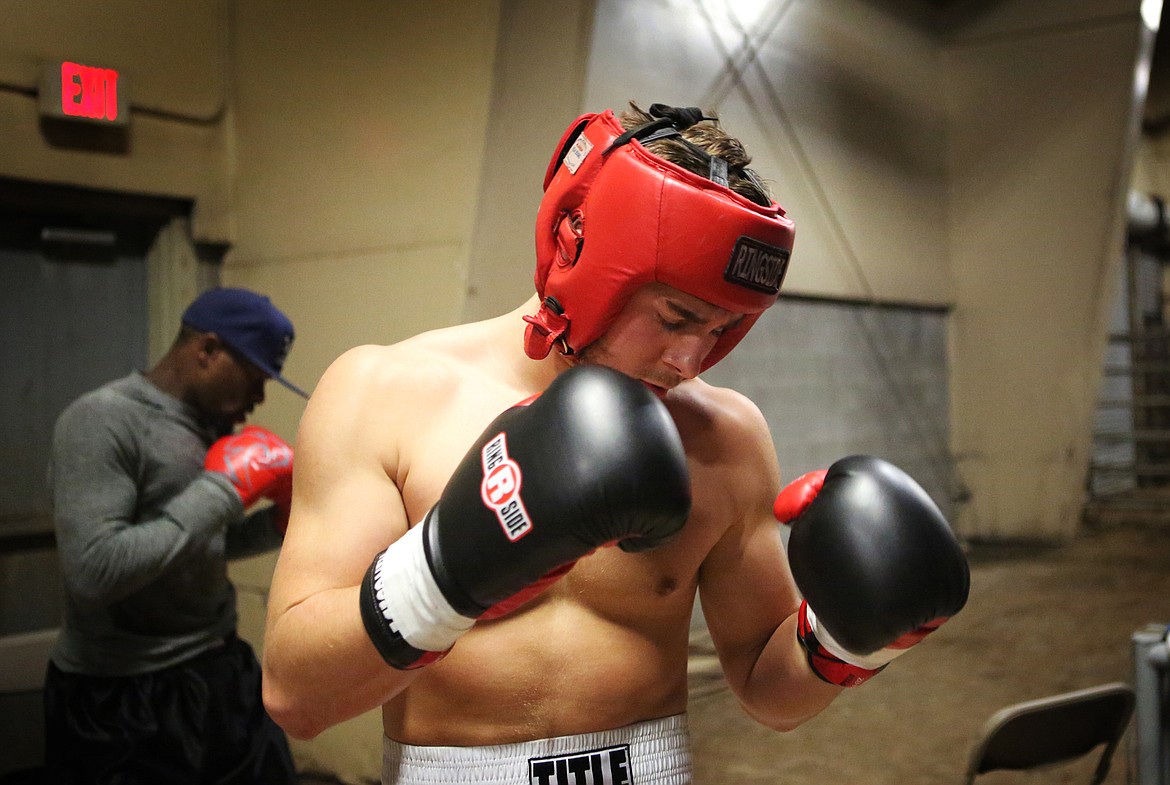 Taylor Reed, 20, warms up for his fight Oct. 28 at Majestic Valley Arena in Kalispell. Reed beat his opponent after three rounds of boxing. (Mackenzie Reiss photos/Daily Inter Lake)