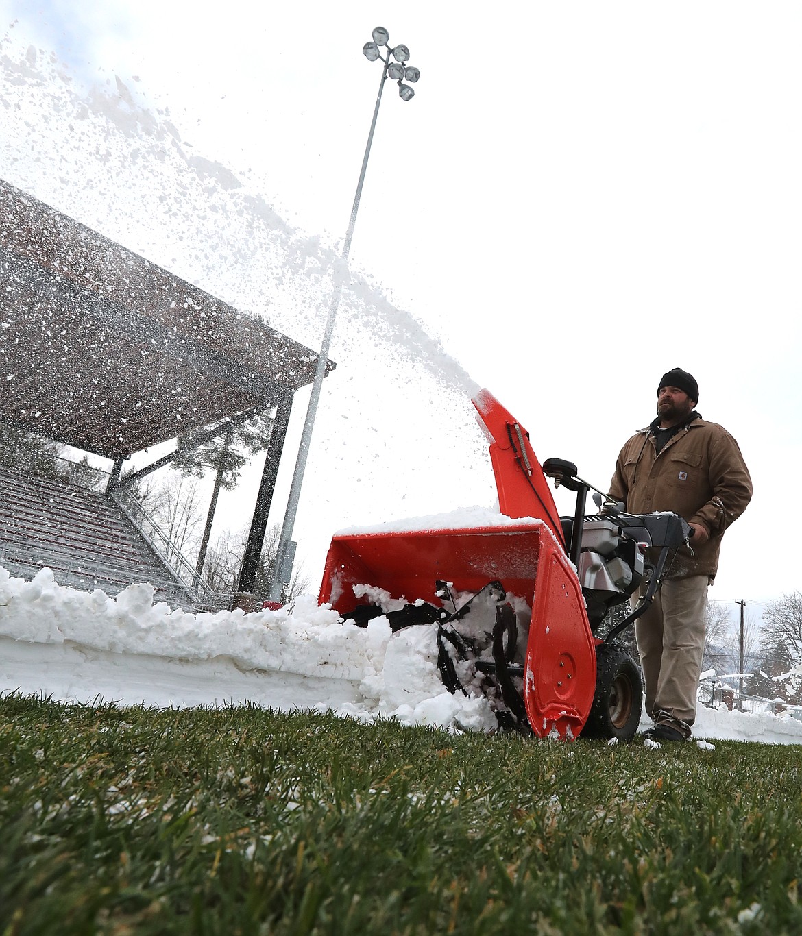 (Photo by ERIC PLUMMER)
Amos Walkington was one of a handful of local volunteers who spent hours clearing helping remove snow so the field could be playable when the Bulldogs hosted Middleton Friday night.