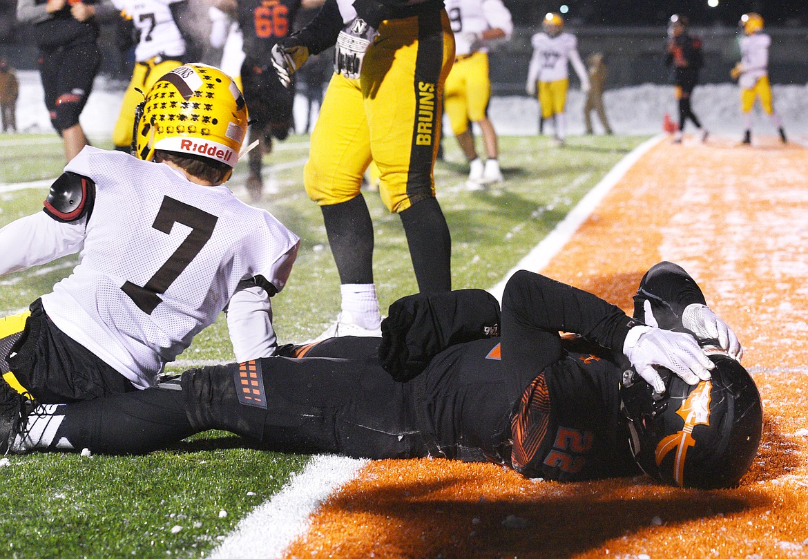 Flathead running back Jonathan Baker puts his hands on his helmet after an incomplete pass on fourth down at the end of the second quarter. (Aaric Bryan/Daily Inter Lake)