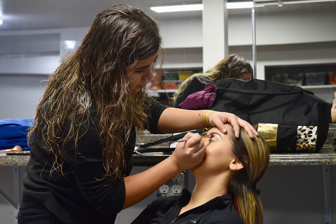 Charles H. Featherstone/Columbia Basin Herald
Othello High School junior Herlinda Montemayor applies eye shadow to 17-year-old Cheyanne Miller at Elegance Hair Academy in Moses Lake.