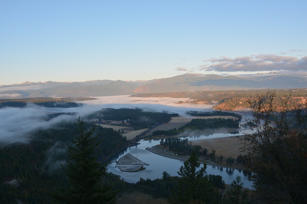 Looking east from the Katka overlook toward the Selkirk mountains, the fog rises over the Kootenai River valley and Bonners Ferry.