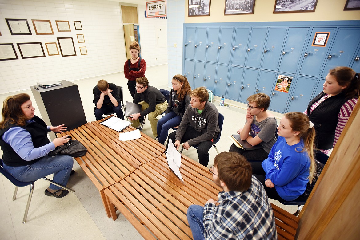 Doni Dilworth, left, talks Monday with students at Flathead High School who will be taking part in the speech and debate tournament this weekend in Kalispell. (Brenda Ahearn photos/Daily Inter Lake)