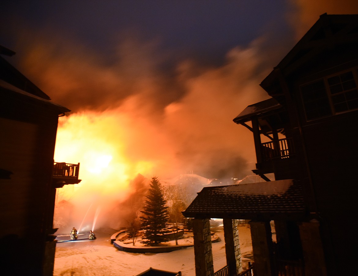 Firefighters were hampered by freezing temperatures, falling snow, and high winds as they battled the blaze on Slopeside Drive on Big Mountain on Thursday night, November 2.(Brenda Ahearn/Daily Inter Lake)