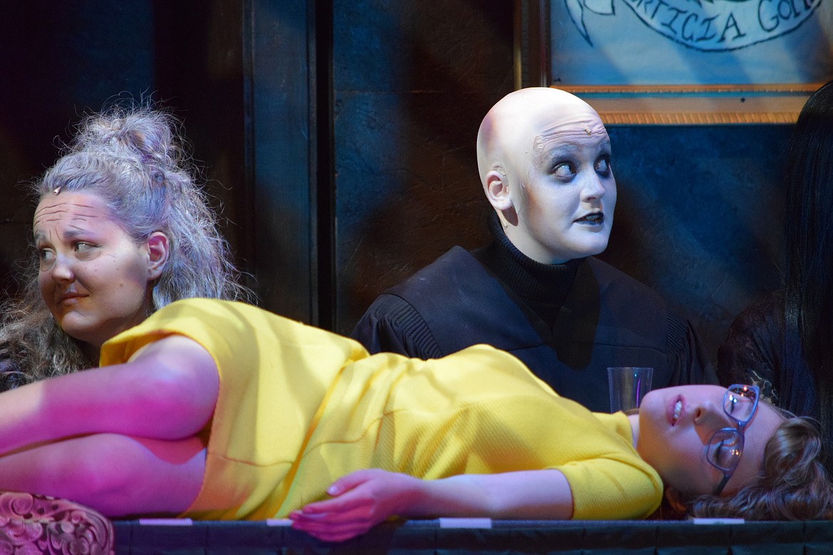 Richard Byrd/Columbia Basin Herald
Uncle Fester (Olivia Carrell), back right, isn&#146;t quite sure what to do when Alice Beineke (Karlye Shank) crawls up onto the table during dinner and seemingly passes out.