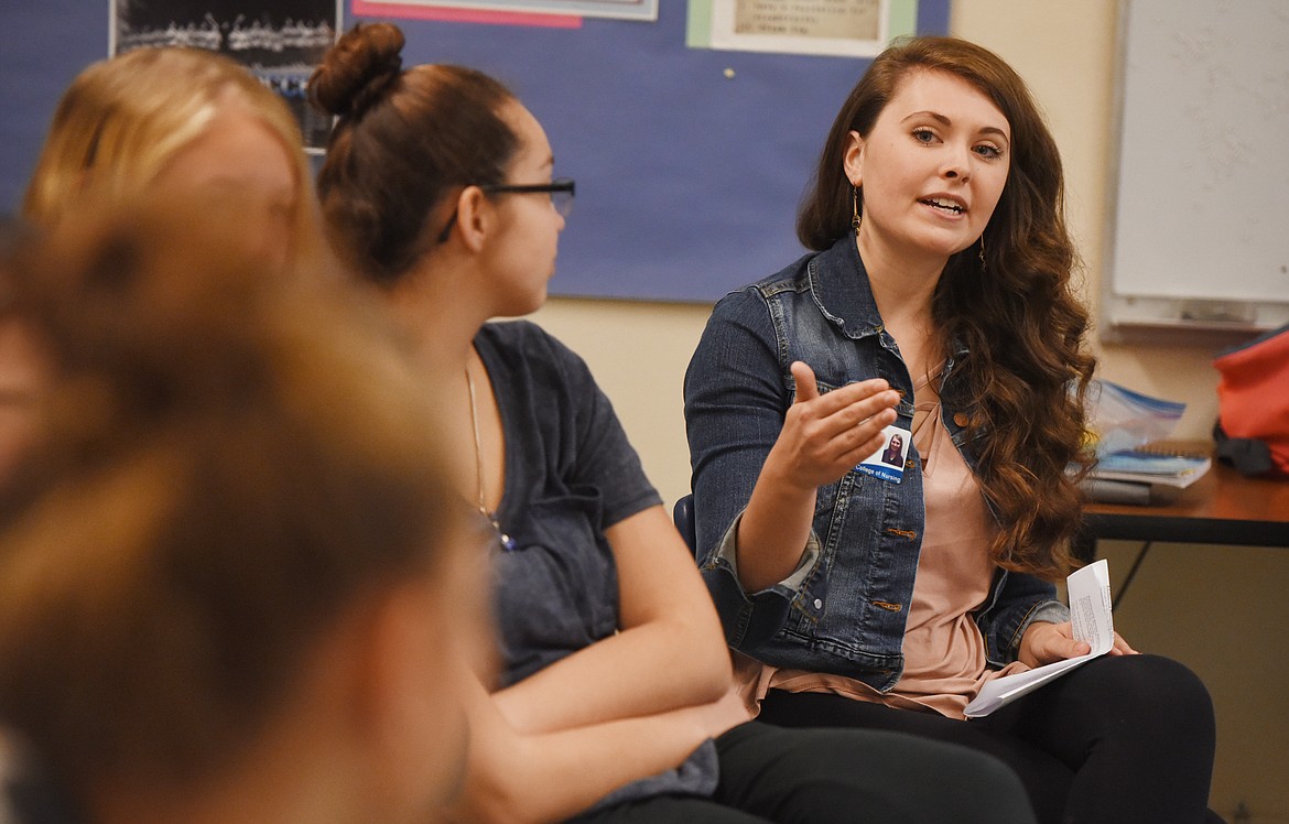 Lauren England talks with students at Columbia Falls High School about a technique for dealing with stress that has students pick a word that is meaningful for them, and repeat it silently as they slowly inhale and exhale.(Brenda Ahearn/Daily Inter Lake)