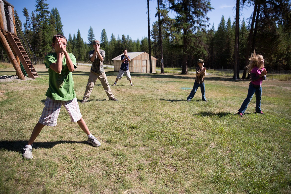 Yaak School students do jumping jacks before starting a game of kickball at the rural school that is featured in a new book called “Chasing Time.” (Courtesy photo)