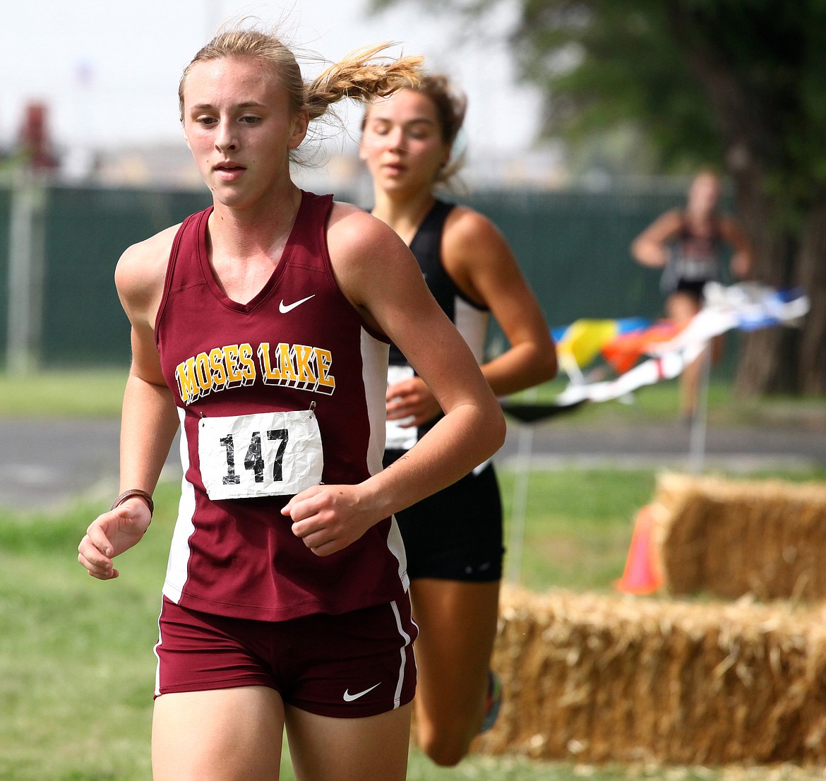 Rodney Harwood/Columbia Basin HeraldMoses Lake's Camille Carpenter (147) , pictured at the Moses Lake Invitational earlier in the year, will be competing in the 4A state cross country championships on Saturday at Sun Willows Golf Course in Pasco.