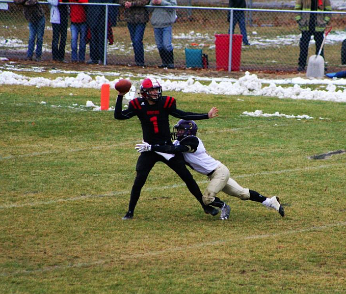 Brett Milholland lays a hit on Gooding&#146;s quarterback during the Wildcats&#146; game with the Senators.