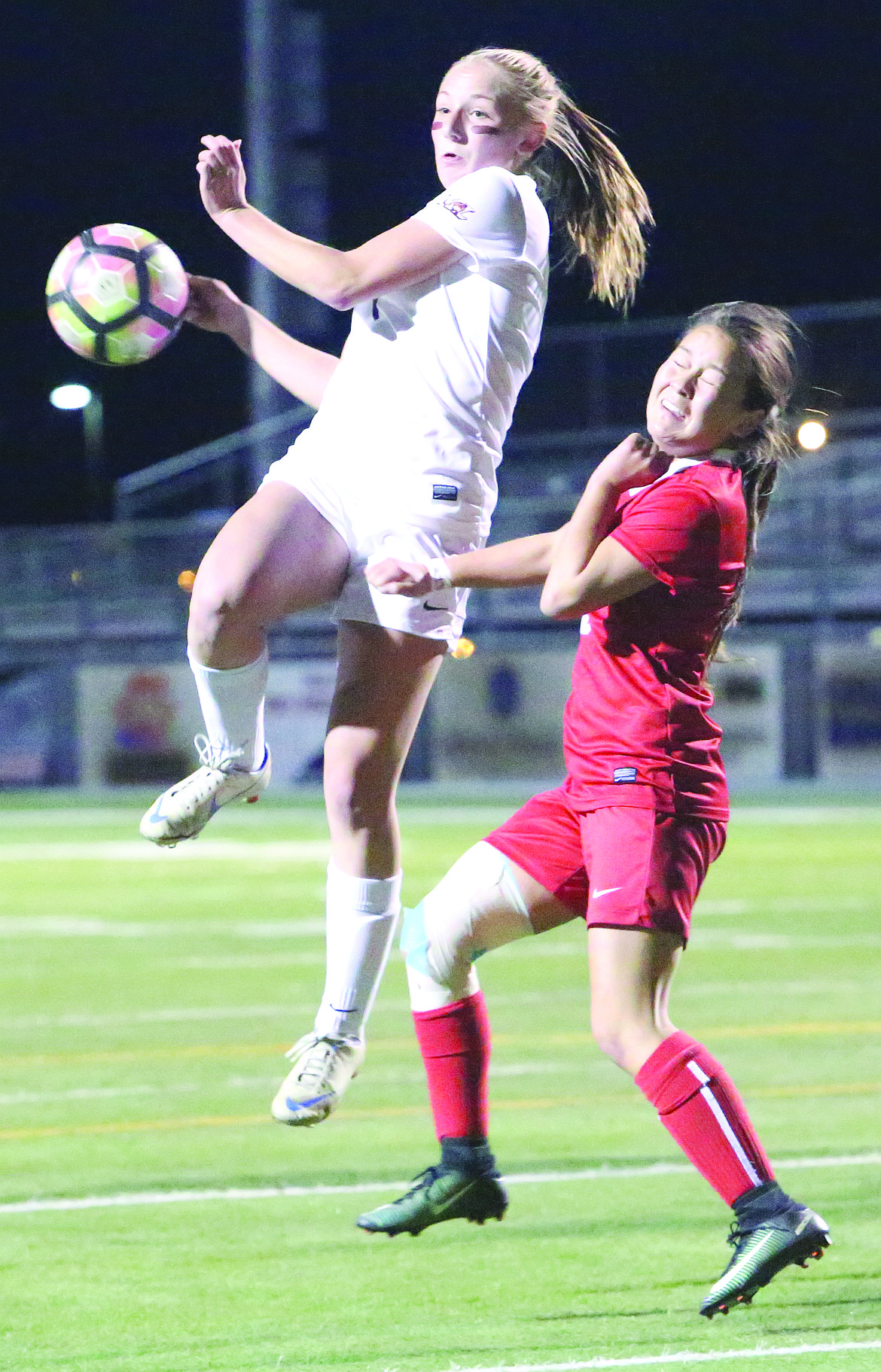 Connor Vanderweyst/Columbia Basin Herald
Moses Lake forward Denali Knowles (right) leaps for the ball against Eastmont.
