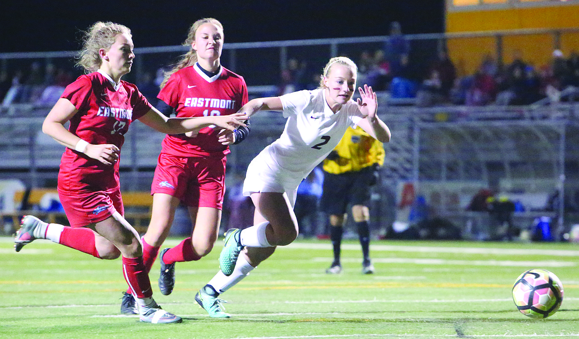 Connor Vanderweyst/Columbia Basin Herald
Moses Lake forward Madi Krogh (2) tries to outrun two Eastmont defenders to the ball.