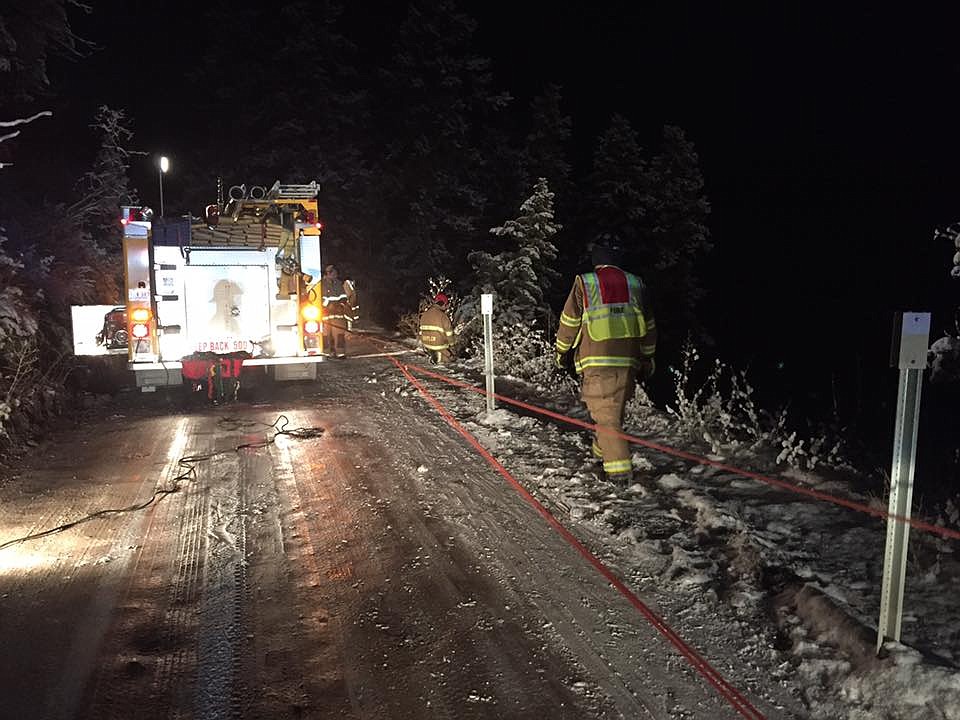 A vehicle went down a steep embankment up Deep Creek and Southside Road early Sunday morning on Nov. 5. Responders said the road was like a &#147;sheet of ice.&#148; The driver escaped without injury. (Photo courtesy of Frenchtown Rural Fire Department)