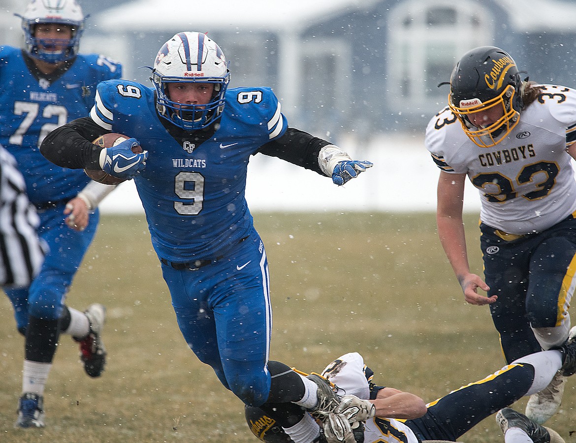 Logan Kolodejchuk fights for extra yards.