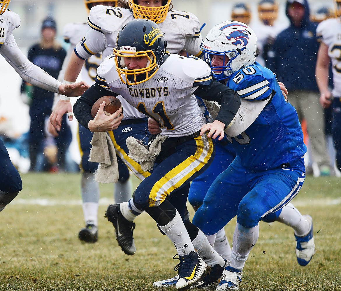 Tanner Gove (50) sacks Miles City quarterback Gabe Gundlach.