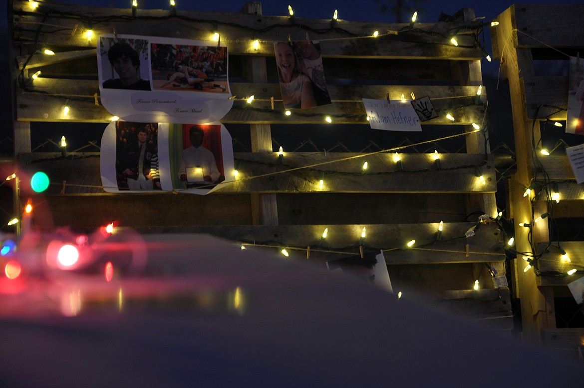 Lights were strung on a memory board, illuminating stories and photos of those lost to suicide at the second annual Light the Night in Ronan on Saturday. (Ashley Fox/Lake County Leader)