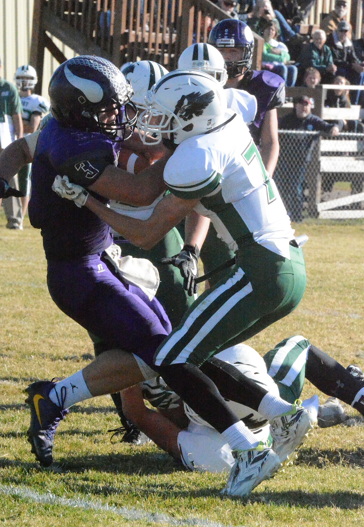 CHARLO HIGH School QB Landers Smith drags Rylan Olson into the end zone in the Charlo-Joliet first round MHSA Class C, 8-man playoff Saturday at Charlo High School. (Jason Blasco/Lake County Leader)