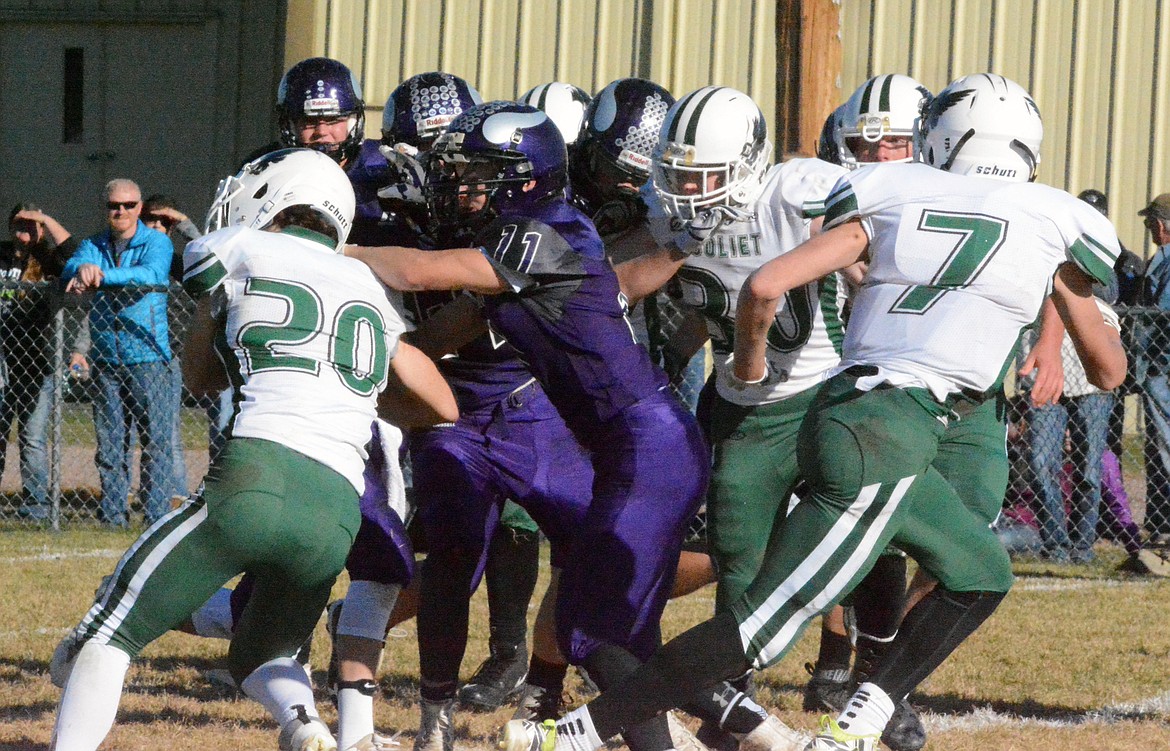 CHARLO VIKINGS defender Garett Vaughan attempts to block Joliet RB 	Trey Oswald during a sequence of the Class C, 8-man MHSA first round of state playoffs Saturday afternoon at Charlo High School. With the Vikings 30-point victory they will now play the No. 1 seeded team out of the East the Forsyth Dogies Saturday at 1 p.m. at Forsyth High School. (Jason Blasco/Lake County Leader)