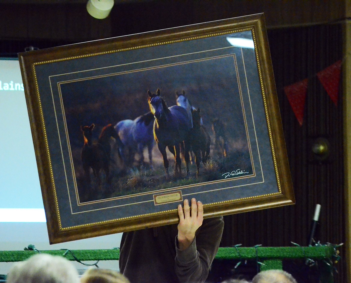 The highly saught after wild horse photo in frame raised nearly $300 for the cemetery just on it&#146;s own. (Erin Jusseaume/ Clark Fork Valley Press)
