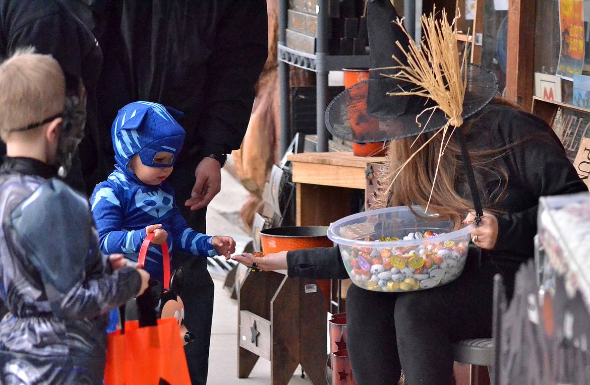 A very friendly witch was hanging out at the Mangy Moose for trick or treaters to stop by as they made their way around town. (Erin Jusseaume/ Clark Fork Valley Press)