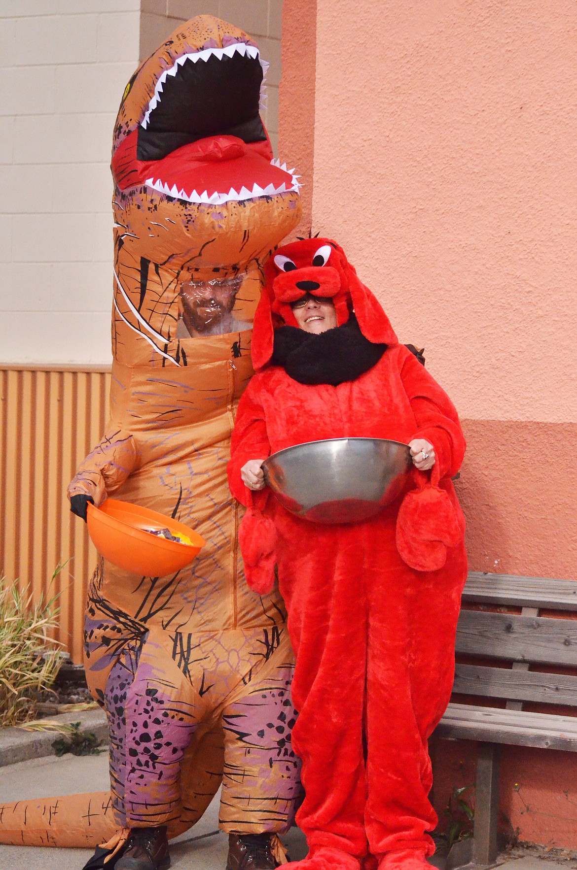 Clifford the Big Red Dog played well with the Gambles Dinosaur while passing out candy to all the kids (Erin Jusseaume/ Clark Fork Valley Press)