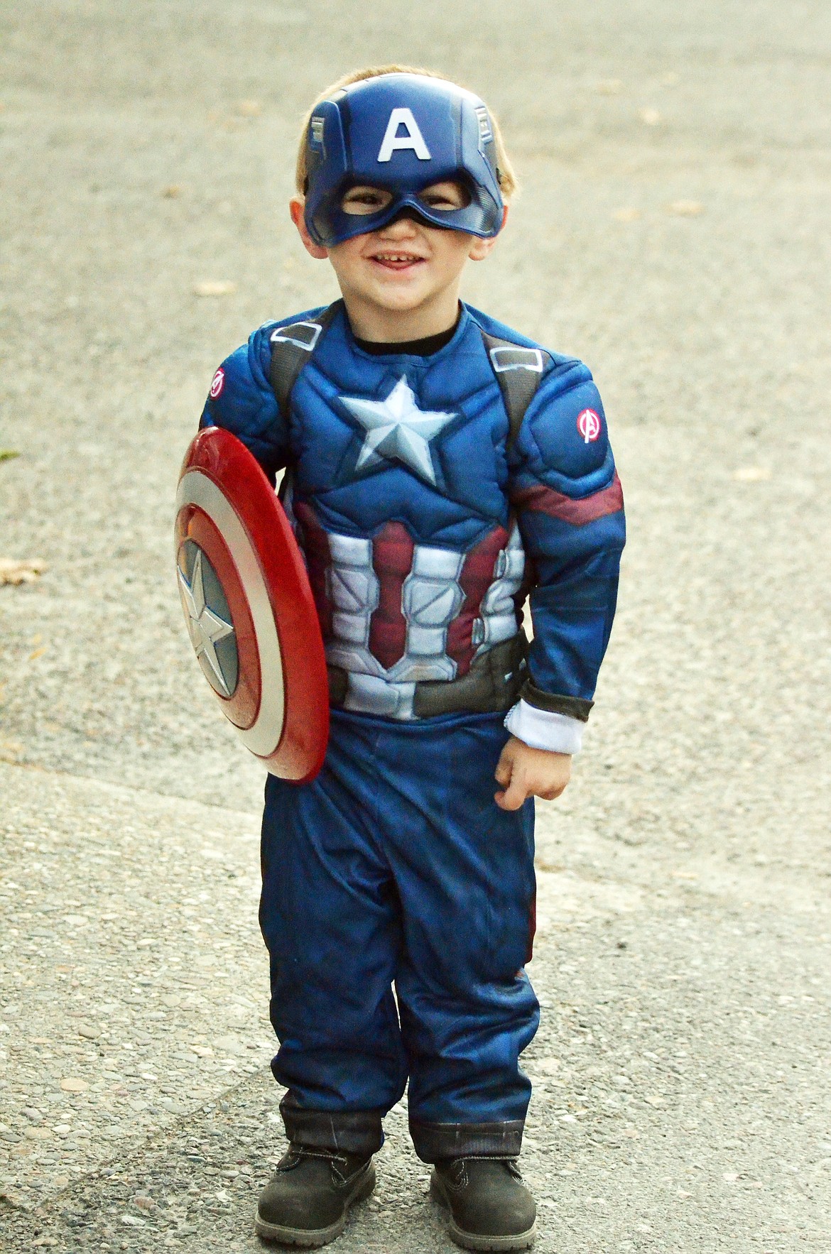 Captain America was all smiles for a quick photograph as he trick or treated the Main Street shops in Plains (Erin Jusseaume/ Clark Fork Valley Press)