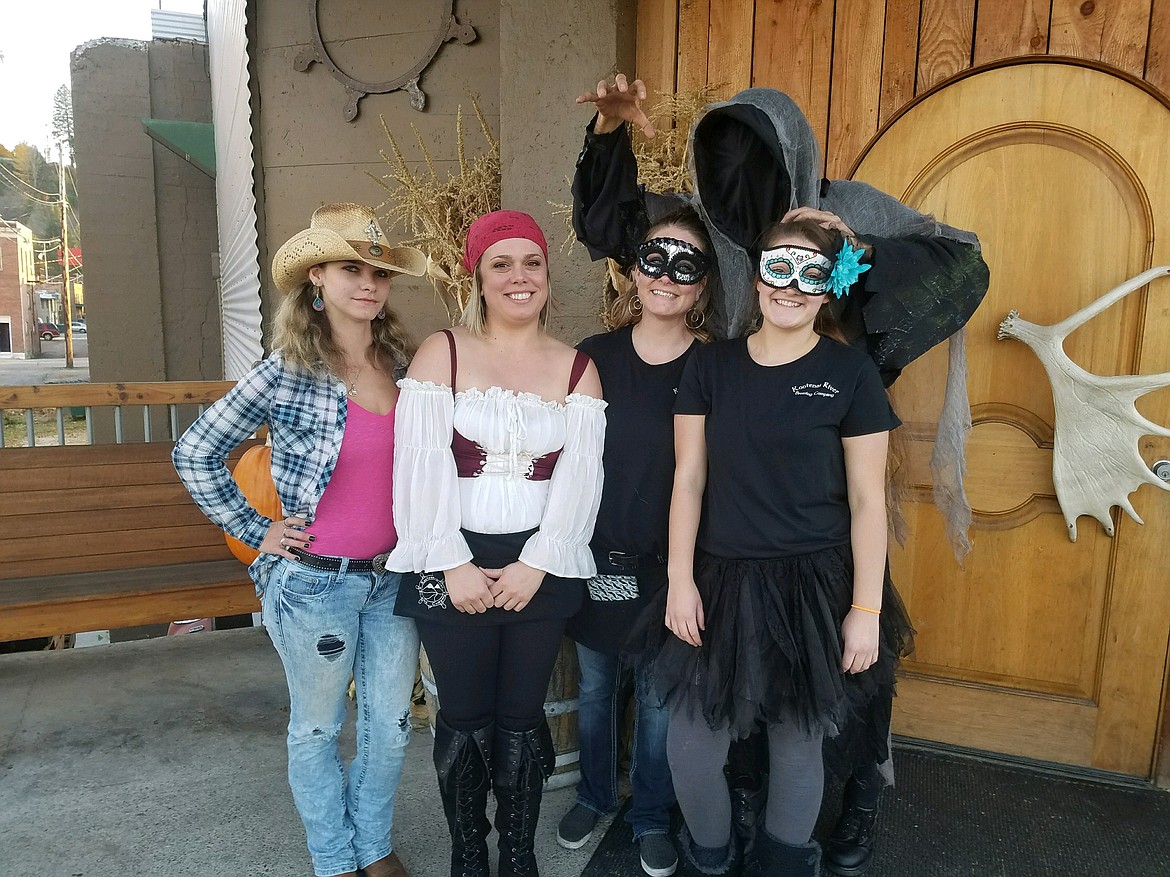 Photos by Mandi Bateman
The employees of the Kootenai River Brewing Company, all decked out for their Friday night Halloween party. Front from left: Kimberly Helsper, Chelsea Hartman, Summer Peterson and Jayden Attaway. Looming over the others is Jeremiah Holes, portraying &#145;Death.&#146;