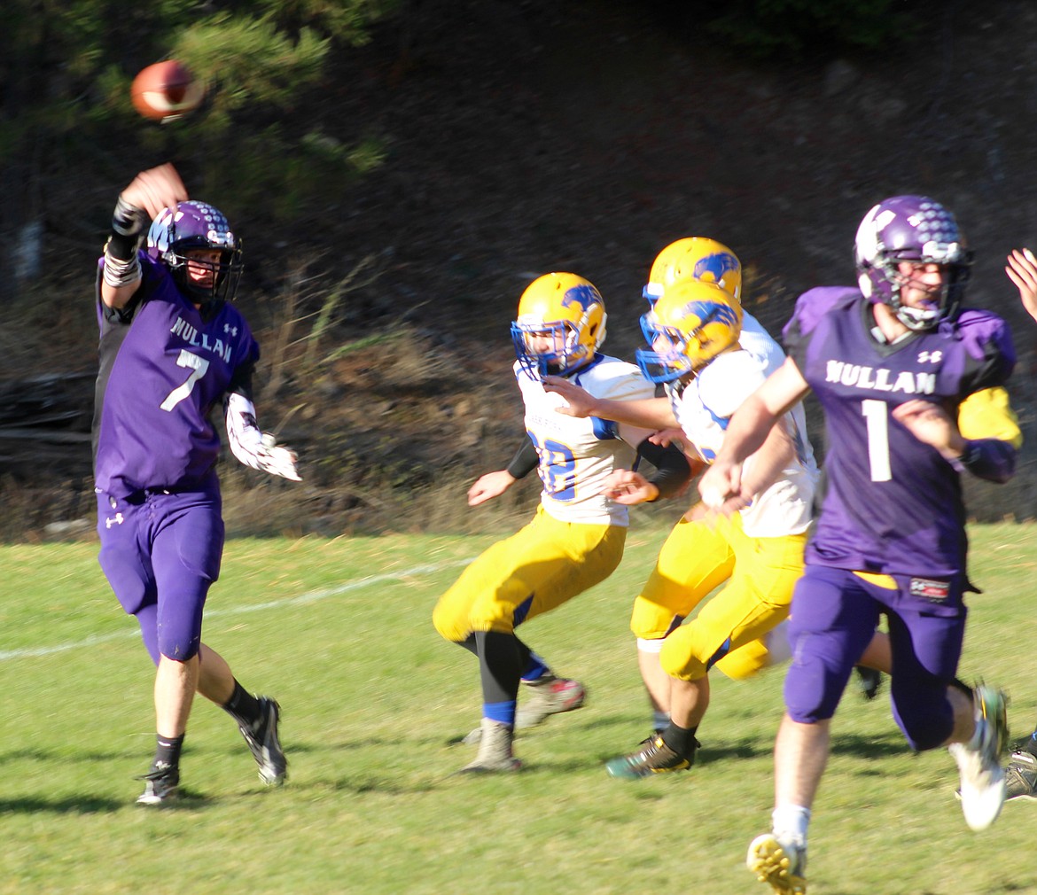 Photo by Chanse Watson/ 
Mullan quarterback Gryphon Todd rolls out to make a throw during the Tiger&#146;s game with Clark Fork last Friday.