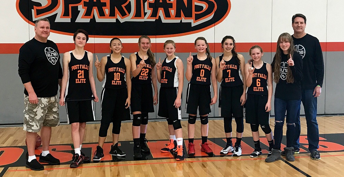 Courtesy photo
The Post Falls Elite Orange eighth-grade girls basketball team went 6-0 and won the championship of the River City seventh- and eighth-grade girls basketball tournament for the second straight year. From left are Bill Owens (coach), Lizzy Owens, Grace Couture-Ishihara, Jadin Krier, Ashley Grant, Mykah Kirking, Americus Crane, Madison Cleave, Hanna Christensen and Craig Christensen (coach).