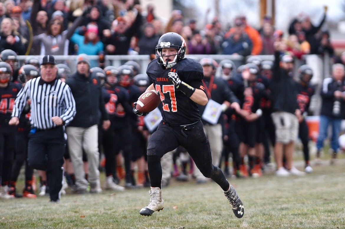 Eureka defensive back Bryant Little returns a fourth-quarter interception to the Shelby 1-yard line during the Class B football state championship game on Saturday at Eureka High School. Eureka beat Shelby 47-7 to capture its second straight state title. (Casey Kreider photo/Daily Inter Lake)