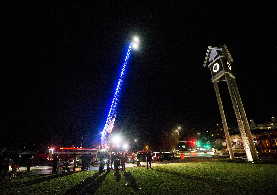 (LOREN BENOIT/Hagadone News Network)
Bystanders gather around a Coeur d&#146;Alene firetruck Monday night at &#147;Light up the Town Blue 2017.&#148;