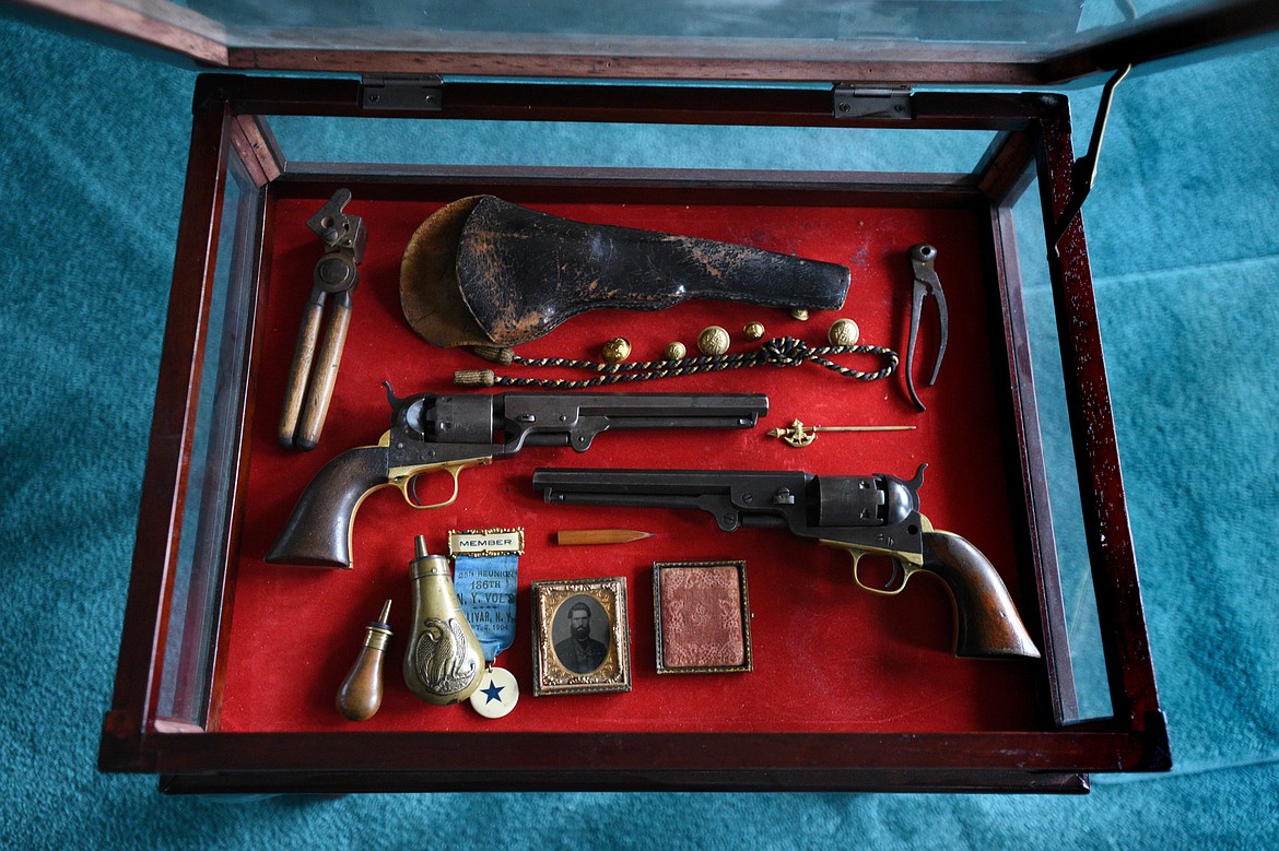 A collection of Civil War memorabilia, including two Colt 1851 Navy pistols, on display in the home of Jack Paulson on Tuesday, Nov. 14.
