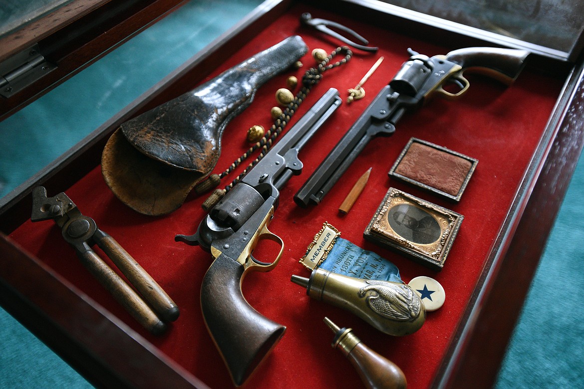 A collection of Civil War memorabilia, including two Colt 1851 Navy pistols.