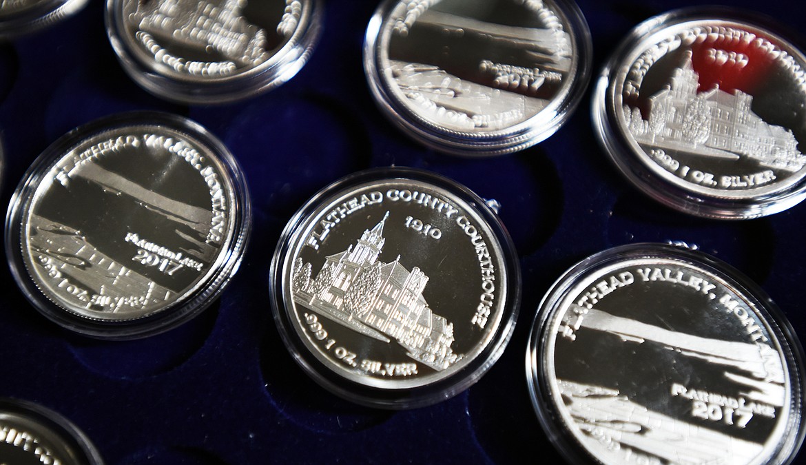 Close up of the 2017 The Uniqueness of Montana silver collector coins. This 2017 coin features a view of the Flathead County Courthouse as it looked in 1910 and a view of Flathead Lake. Another Flathead coin featuring Big Mountain is expected by the end of the year. (Brenda Ahearn/Daily Inter Lake)