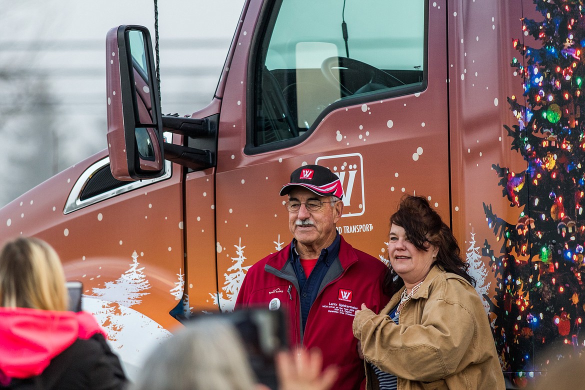 Montana trucker Larry Spiekermeier, chosen to drive the Capitol Christmas Tree to Washington, D.C., poses for photos Tuesday in Libby. (John Blodgett/The Western News)