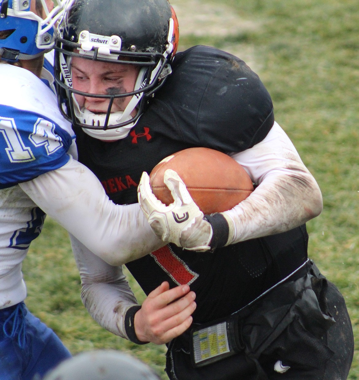 Eureka quarterback Garrett Graves puts his shoulder into a Fairfield defender as he runs for a first down in the Lions' 31-6 victory on Saturday in the Class B semifinals. (Carmen Davis photo)