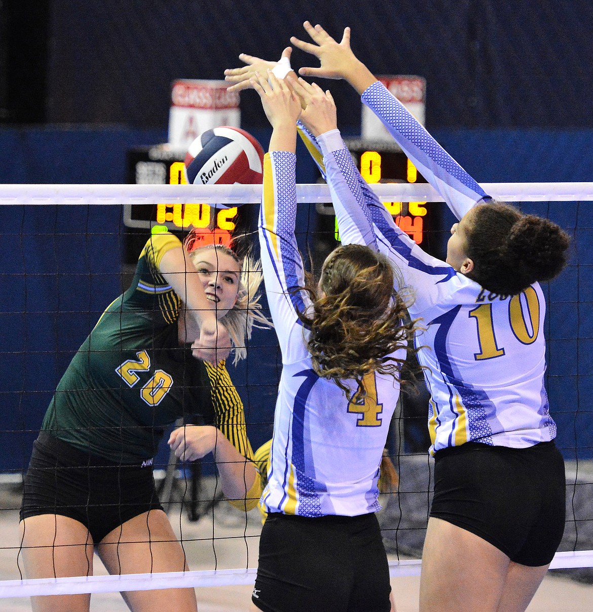 Jayden Winslow and Mehki Sykes block Cailyn Ross of Whitefish. (Jeff Doorn photo)
