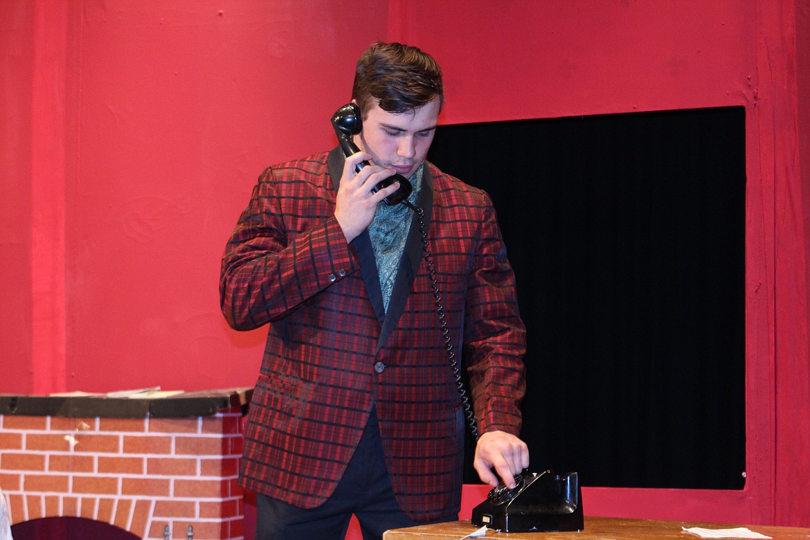 Cheryl Schweizer/Columbia Basin Herald
Who&#146;s Sam Slaughter (Jerry Hodges) &#8211; that cad and bounder &#8211; and who&#146;s he calling? The Quincy High School production of &#145;It Was a Dark and Stormy Night&#146; opens Thursday.