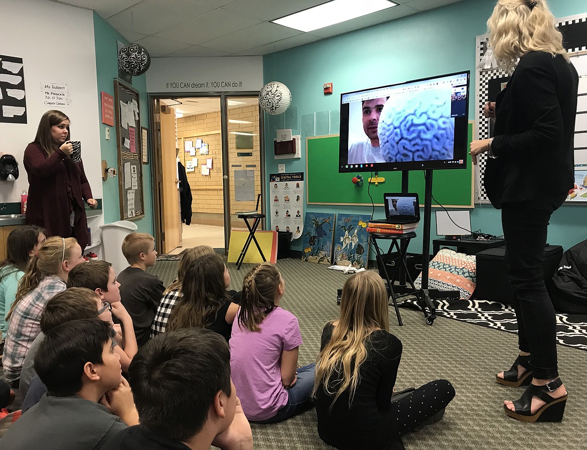 Swan River fifth- and sixth-grade students listen to Digital Explorer Founder Jamie Buchanan-Dunlop talk about brain coral. Buchanan-Dunlop is researching coral reefs at the Bermuda Institute of Ocean Sciences in Bermuda. (Hilary Matheson photos/Daily Inter Lake)