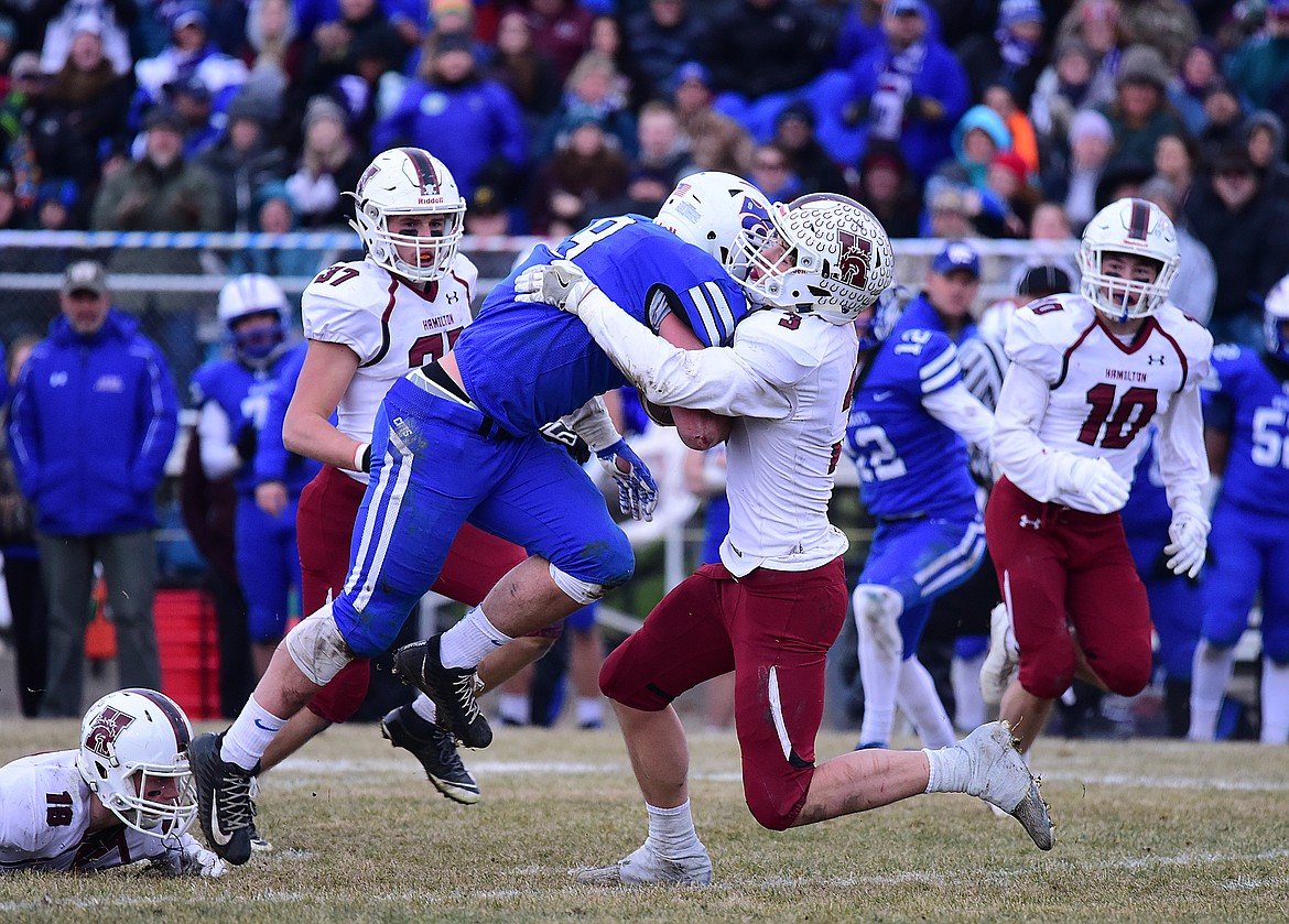 Logan Kolodejchuk collides with a Hamilton defender.