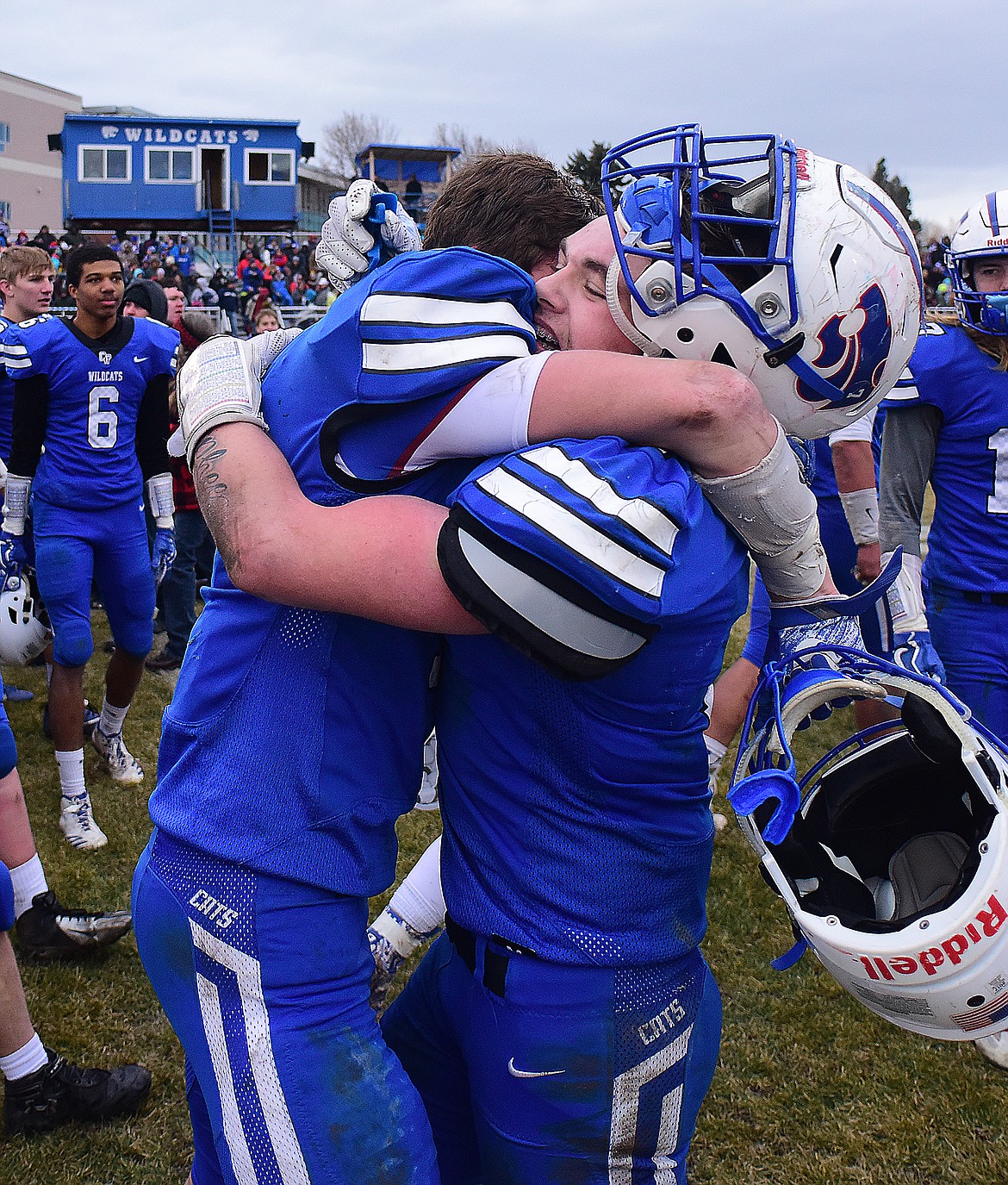 Ben Windauer, left, gives Colten McPhee a big hug after the Wildcats won the state A championship Saturday.