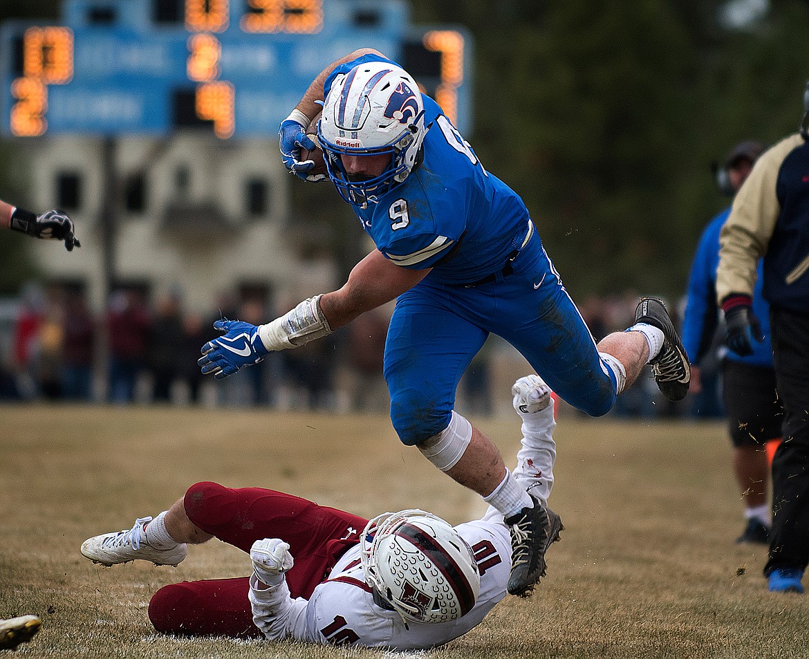 Logan Kolodejchuk gets tripped up in the first half after a good gain (Jeremy Weber photo)