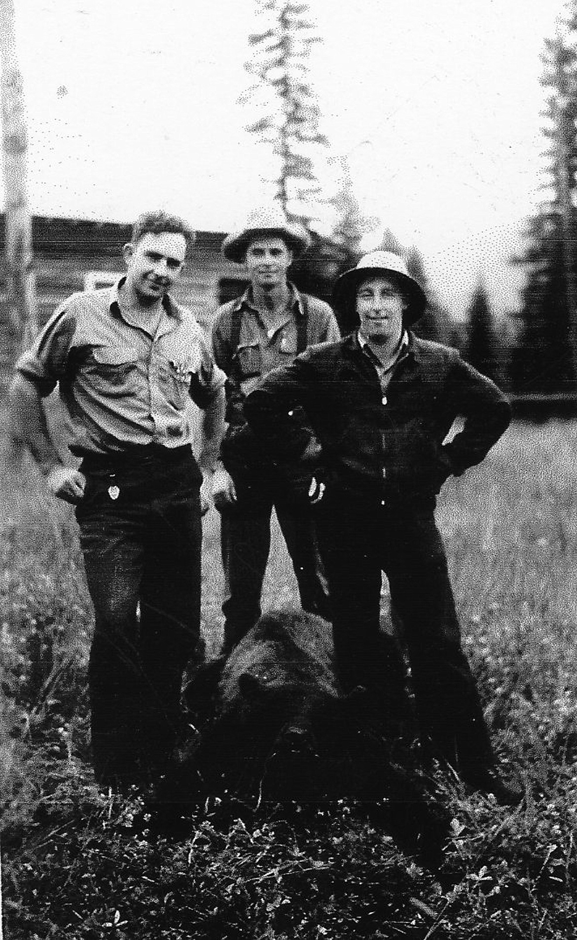 Early Flathead Valley hunters are seen with a bear. The man at center is the author&#146;s uncle Addie.. (Rick Funk photos)