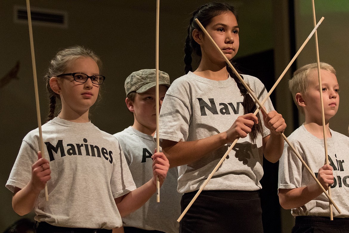 Kootenai Valley Christian School students, from left, Olivia Sanderson, Nicholas Silbermann, Augustine Bailey and Henry Rank perform in a skit honoring the service of veterans at a program at Libby Christian Church on Friday, Nov. 10, 2017. (John Blodgett/The Western News)