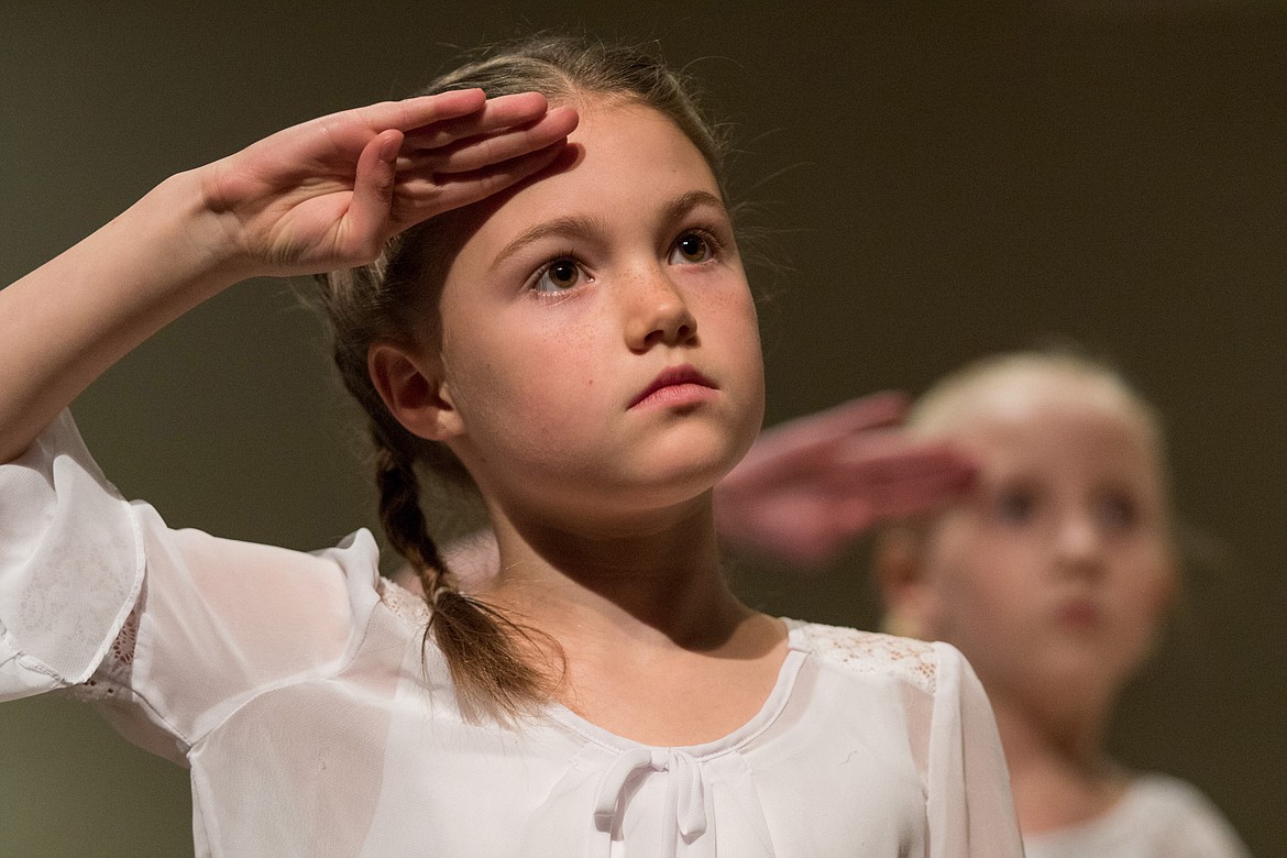 Zoe Warner, foreground, and Mady Schmitt -- third and fifth graders, respectively, at Kootenai Valley Christian School in Libby -- perform during the school&#146;s 21st annual Veterans Day program at Libby Christian Church Friday, Nov. 10, 2017. (John Blodgett/The Western News)