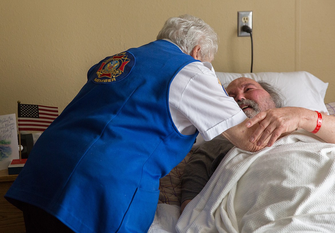 Stella Sharp of the Libby VFW goes to give veteran Duaine Schultz a hug at Libby Care Center Saturday, Nov. 11. (John Blodgett/The Western News)