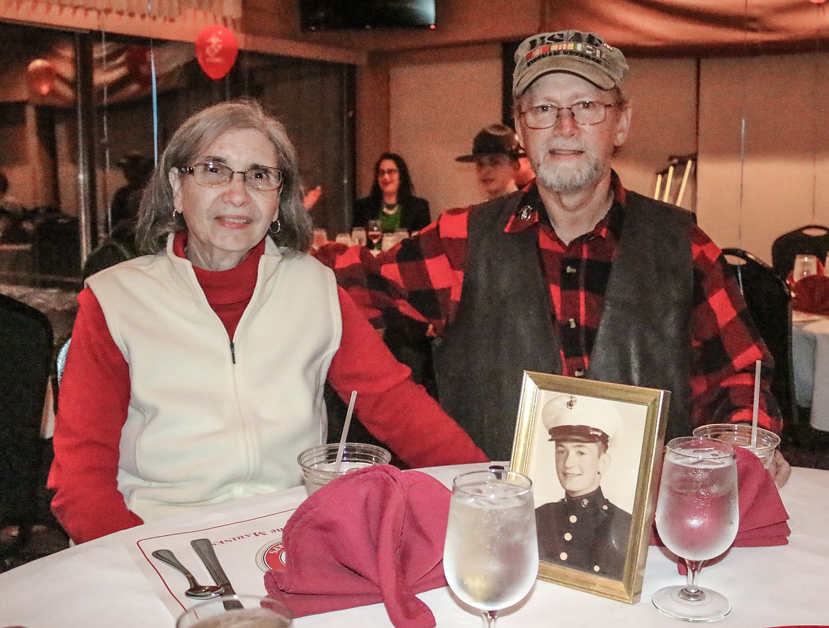 Photo by Mandi Bateman
Veterans of the Airforce, and high school sweethearts, Terry and Jackie Spence, at the Marine Corps birthday celebration, with a photo of Jack Spence, Terry&#146;s father, a Marine Corps veteran.