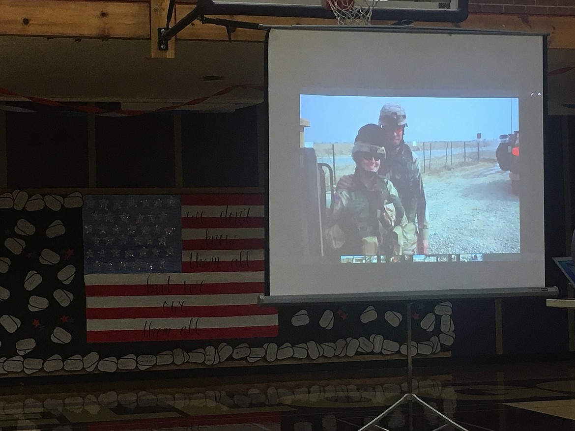 During the KHS assembly, guest speaker, Major Nicole Kessler of the Army, spoke of her deployment experiences while presenting a slideshow. The picture displayed shows Kessler and her husband, Kevin, serving their country together.