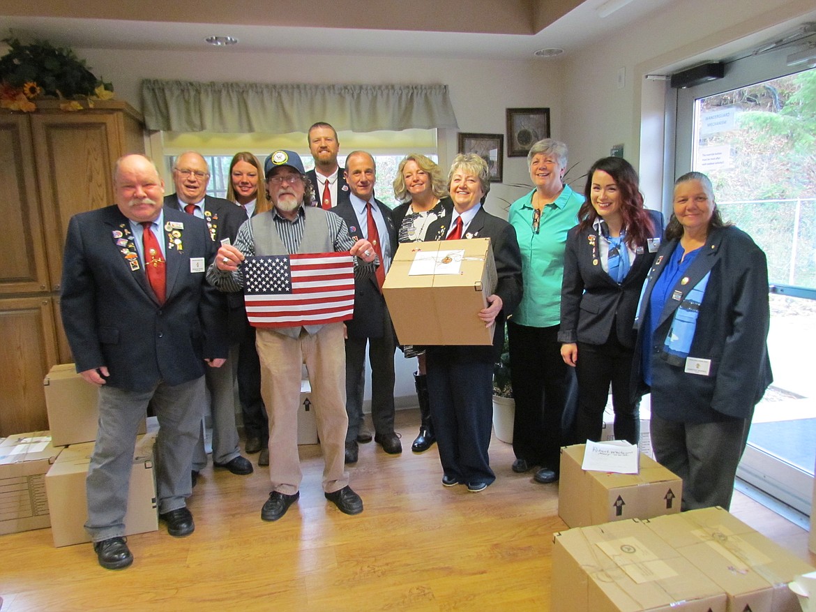 Photo courtesy of GREG MALONE
Members of Wallace Elks Lodge No. 331 who honored local veterans at Good Samaritan in Silverton on Nov. 11. The group presented 18 vets with personalized care packages as a small token of their appreciation for their service. Care packages included items like electric shavers, winter gloves, service hats, socks, blankets, and individual personal care items. Sharon Howard, Elks member and Air Force vet, said that would like to see the program grow and reach out to more local veterans in need. &#147;Veterans are nationally recognized one day a year, but it is (our) goal to help and appreciate our local veterans on a year-long schedule.&#148;