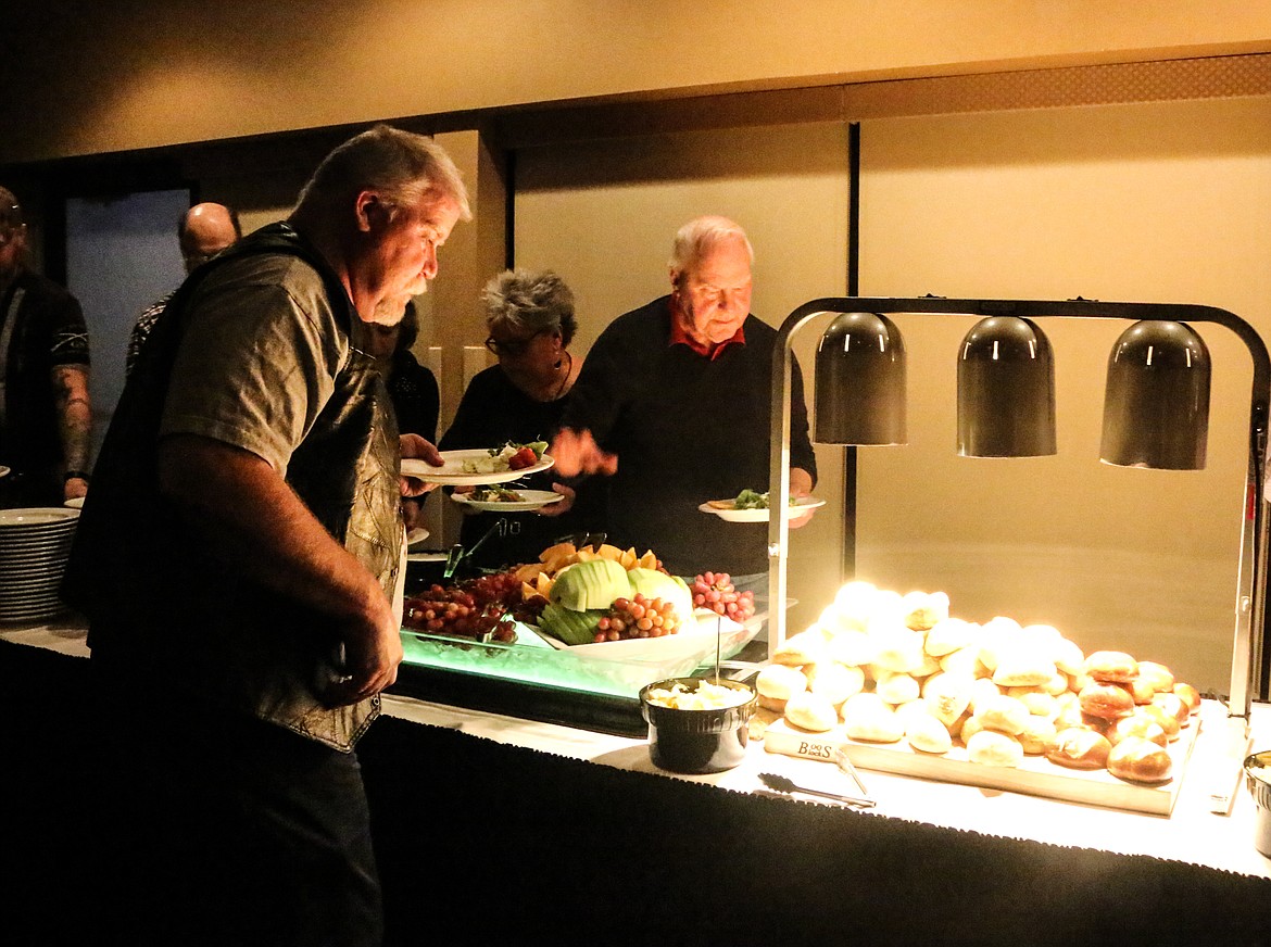 Photo by Mandi Bateman
Dave Koon makes his way down the extravagant buffet put on by The Springs Restaurant at the Kootenai River Inn.